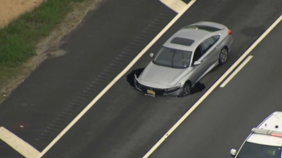 Sinkhole on Long Island Expressway closes multiple lanes of traffic, leaves car stuck - NBC New York